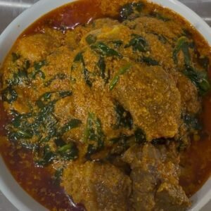 Bowl of Egusi soup with assorted beef