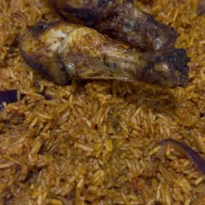 Jollofrice plate served with 2 proteins